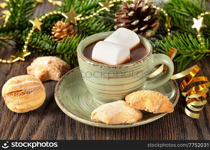 Hot chocolate, Christmas traditional cocoa drink, sweet cookies and decorations on a brown wooden background. 
