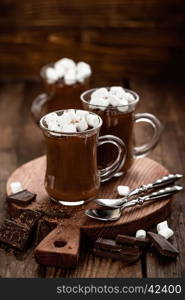 hot chocolate dessert with marshmallows on wooden background