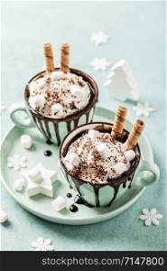 Hot chocolate festive dessert with whipped cream or ice cream