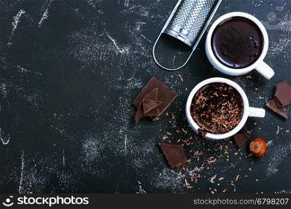 hot chocolate in cup and on a table