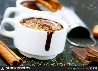 hot chocolate in cup and on a table