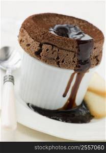 Hot Chocolate Souffle with Chocolate sauce and Langue de Chat Biscuits