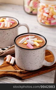 Hot chocolate with marshmallow in a cup on wooden background. Hot cocoa with marshmallow