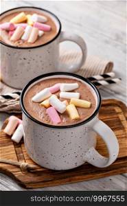 Hot chocolate with marshmallow in a cup on wooden background. Hot cocoa with marshmallow