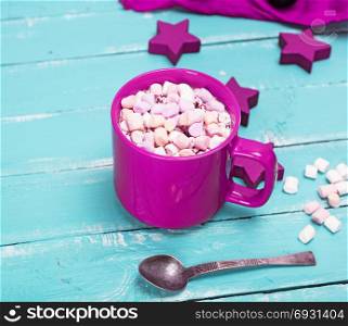 hot chocolate with marshmallow in a purple ceramic mug