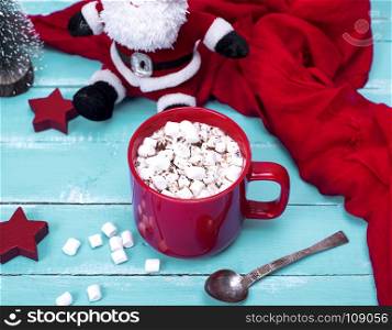 hot chocolate with marshmallow in a red ceramic mug