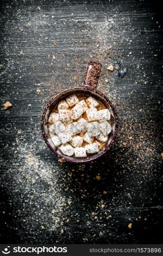 Hot chocolate with marshmallows. On a black chalkboard.. Hot chocolate with marshmallows. On black chalkboard.
