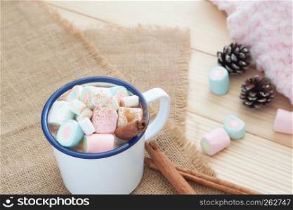 Hot chocolate with marshmallows. Pastel colour. Winter drink
