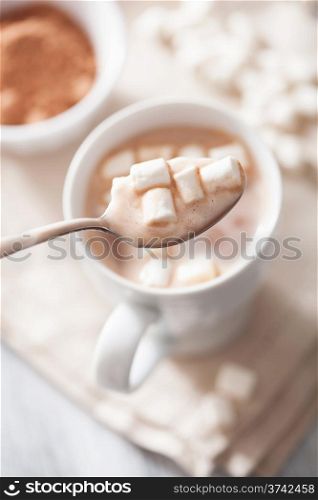 hot chocolate with mini marshmallows in spoon