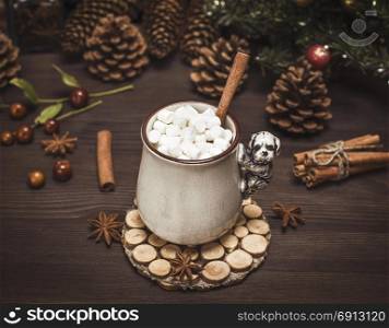 hot chocolate with white marshmallow slices in a ceramic mug on a brown wooden table, vintage toning