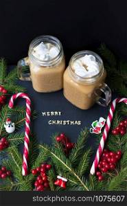 hot cocoa and candy marshmellou on the background of trees. The inscription Merry Christmas.. hot cocoa and candy marshmellou on the background of trees. The inscription Merry Christmas