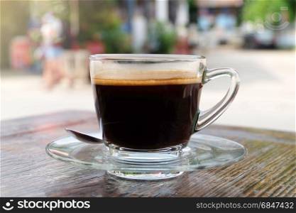 Hot coffee (Americano) on wooden table in relax morning.. Hot coffee cup
