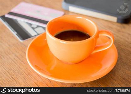 Hot coffee cup on wooden table, stock photo
