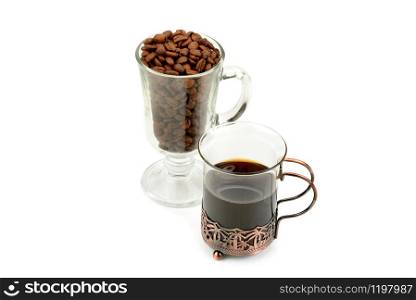 Hot coffee in a delicate glass and coffee beans isolated on white background.