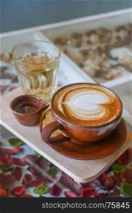 Hot coffee latte with foam milk art of love. Hot coffee latte