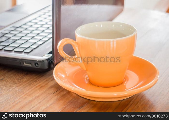 Hot cup of tea on work table, stock photo