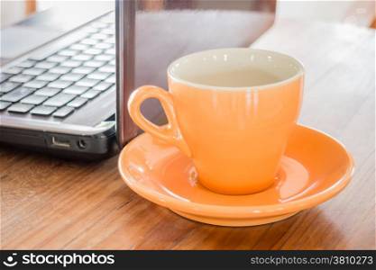 Hot cup of tea on work table, stock photo