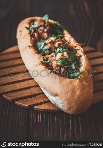 Hot dog bun stuffed with meatballs