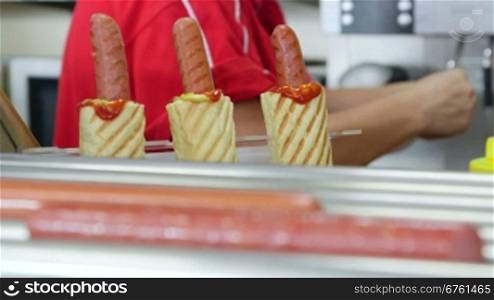 Hot dog lunch in takeout restaurant rack focus