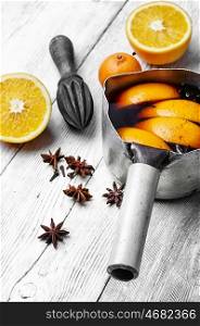 hot drink based on red wine,orange and spices in saucepan