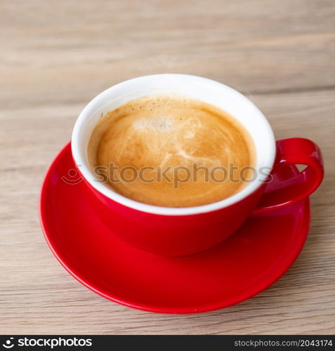 Hot espresso coffee on table, Red coffee cup in cafe or home.Top view with blank copy space for your text.