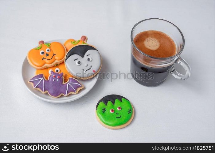 hot espresso coffee or chocolate cup with funny Halloween Cookies. Happy Halloween day, Trick or Threat, Hello October, fall autumn, Traditional, party and holiday concept