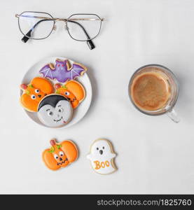 hot espresso coffee or chocolate cup with funny Halloween Cookies. Happy Halloween day, Trick or Threat, Hello October, fall autumn, Traditional, party and holiday concept