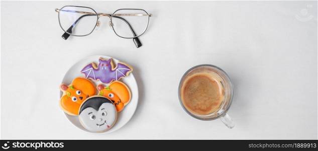 hot espresso coffee or chocolate cup with funny Halloween Cookies. Happy Halloween day, Trick or Threat, Hello October, fall autumn, Traditional, party and holiday concept