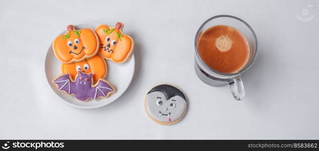 hot espresso coffee  or chocolate cup with funny Halloween Cookies. Happy Halloween day, Trick or Threat, Hello October, fall autumn, Traditional, party and holiday concept