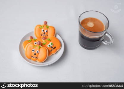 hot espresso coffee  or chocolate cup with funny Halloween Cookies. Happy Halloween day, Trick or Threat, Hello October, fall autumn, Traditional, party and holiday concept