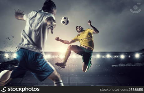 Hot football moments. Football players at stadium field fighting for ball