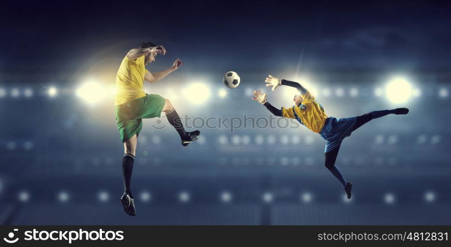 Hot football moments. Football players at stadium field fighting for ball