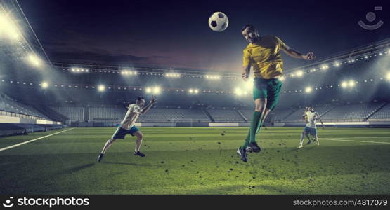 Hot football moments. Football players at stadium field fighting for ball