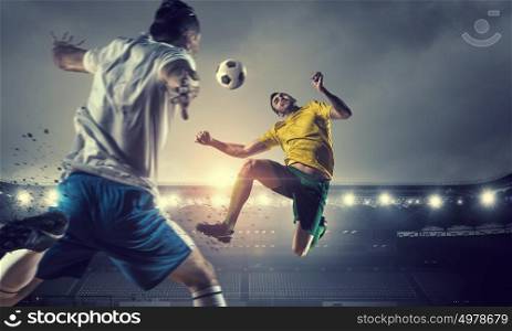 Hot football moments. Football players at stadium field fighting for ball