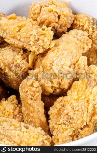 hot fried chiken wings in basket close up