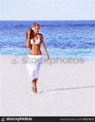 Hot girl walking on the beach, enjoying holidays and vacation, beautiful woman sunbathing, sexy female wearing white bikini, fit healthy woman on resort, happy active girl traveling