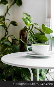 hot green tea matcha latte cup white table