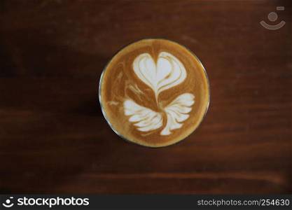 hot latte coffee on wood background