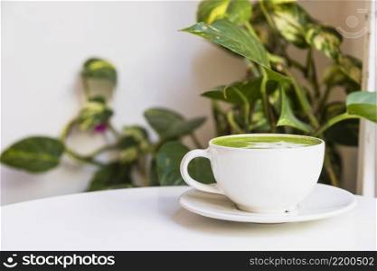 hot matcha green tea cup saucer white table