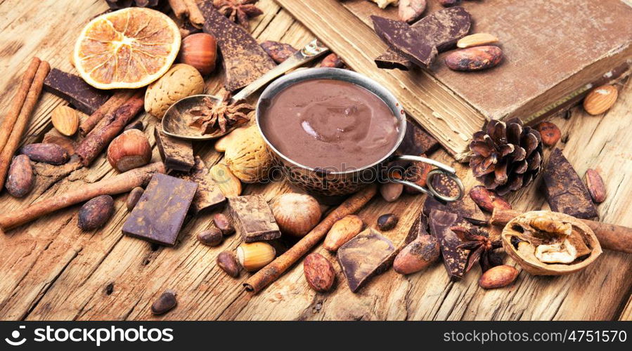 Hot melted chocolate. Hot melted black chocolate in a stylish mug