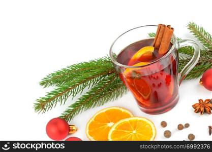 Hot red mulled wine isolated on white background with spices, orange slice, anise and cinnamon sticks, close up. Flat lay, top view. Free space for text.