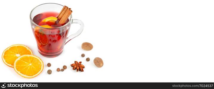 Hot red mulled wine isolated on white background with spices, orange slice, anise and cinnamon sticks, close up. Flat lay. Free space for text. Wide photo