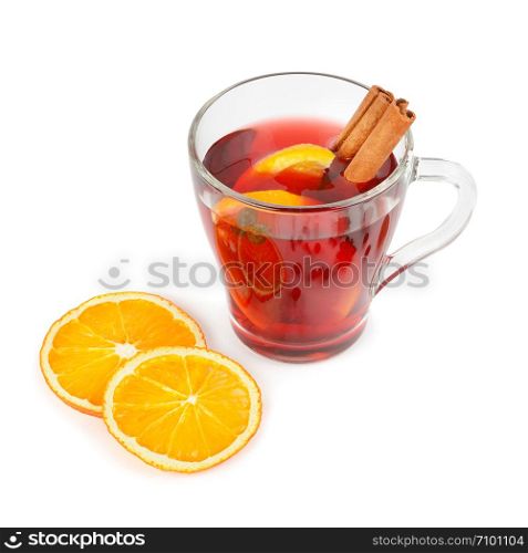 Hot red mulled wine isolated on white background with spices, orange slice, anise and cinnamon sticks.