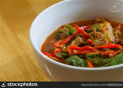Hot Spicy curry with pork on wooden, Thai food