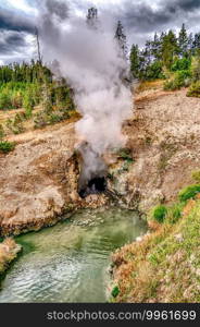 hot spring and geiser in yellowstone national par 