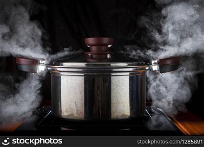 hot steam boiler pot on electric magnetic oven