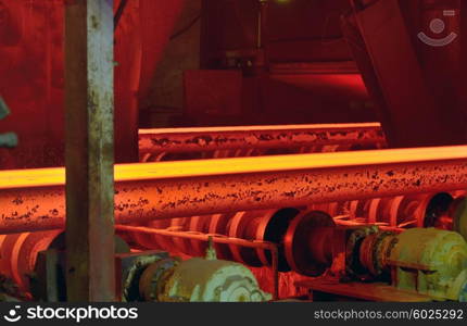 hot steel on conveyor in steel mill