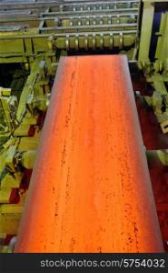 hot steel on conveyor inside of plant