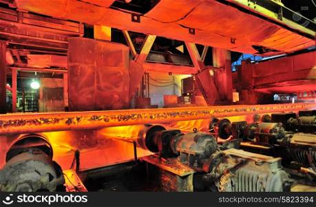 hot steel on conveyor inside of plant