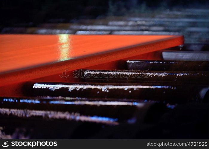 Hot steel plate on conveyor